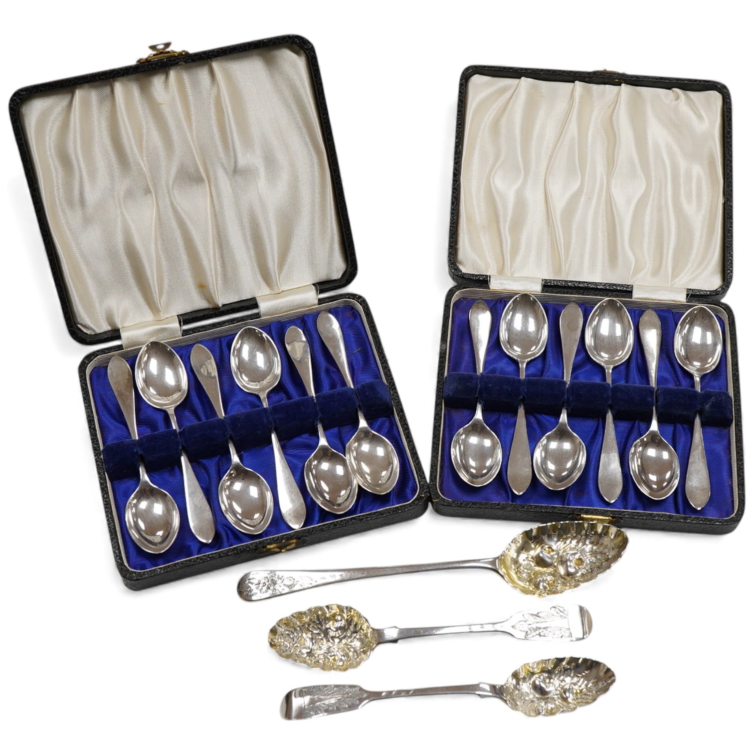 Two cased sets of six George VI silver teaspoons, Haseler & Restall, Birmingham, 1947, together with three assorted 19th century silver berry spoons.